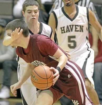 Strath Haven's Mike Fisher, seen here re-arranging West Chester Henderson's Chas McCormick's face, was a big reason why the Panthers eked out a 47-45 win over the Warriors in the first round of the District One Class AAAA playoffs.TIMES STAFF/ROBERT J. GURECKI