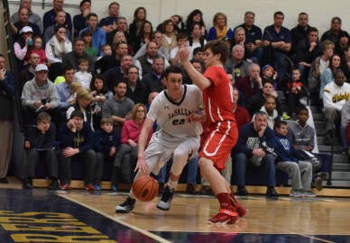 Archbishop Carroll's Ryan Daly, here guarding La Salle's David Krmpotich Jan. 25, has helped keep the Patriots consistently successful this season. (Special to the Times)